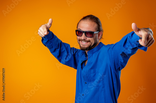 Cool long haired joyful man wearing glasses