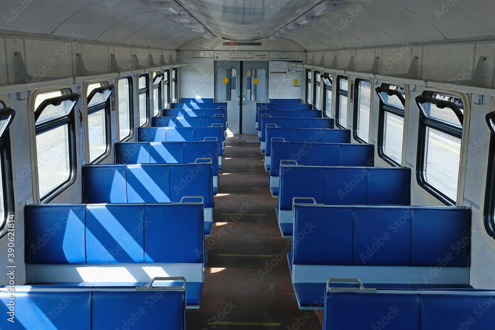 Obraz premium Empty train carriage with blue seats