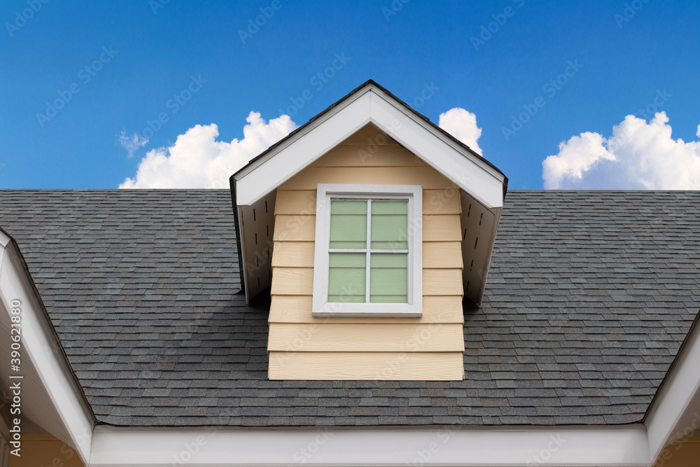 fake window on garret house and roof shingle wirh blue sky background. Asphalt Shingles or Bitumen Tiles. fake window on garret house and roof shingle wirh blue sky background. Asphalt Shingles or Bitumen Tiles.
