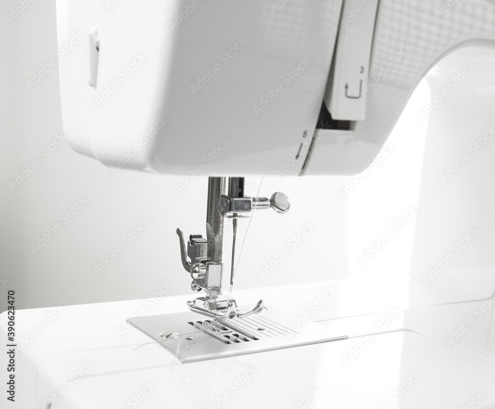 Close-up of sewing machine and sewing needle in fashion design studio