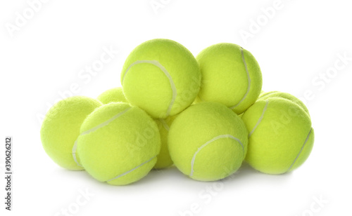 Heap of tennis balls on white background. Sports equipment © New Africa