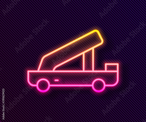 Glowing neon line Passenger ladder for plane boarding icon isolated on black background. Airport stair travel. Vector.