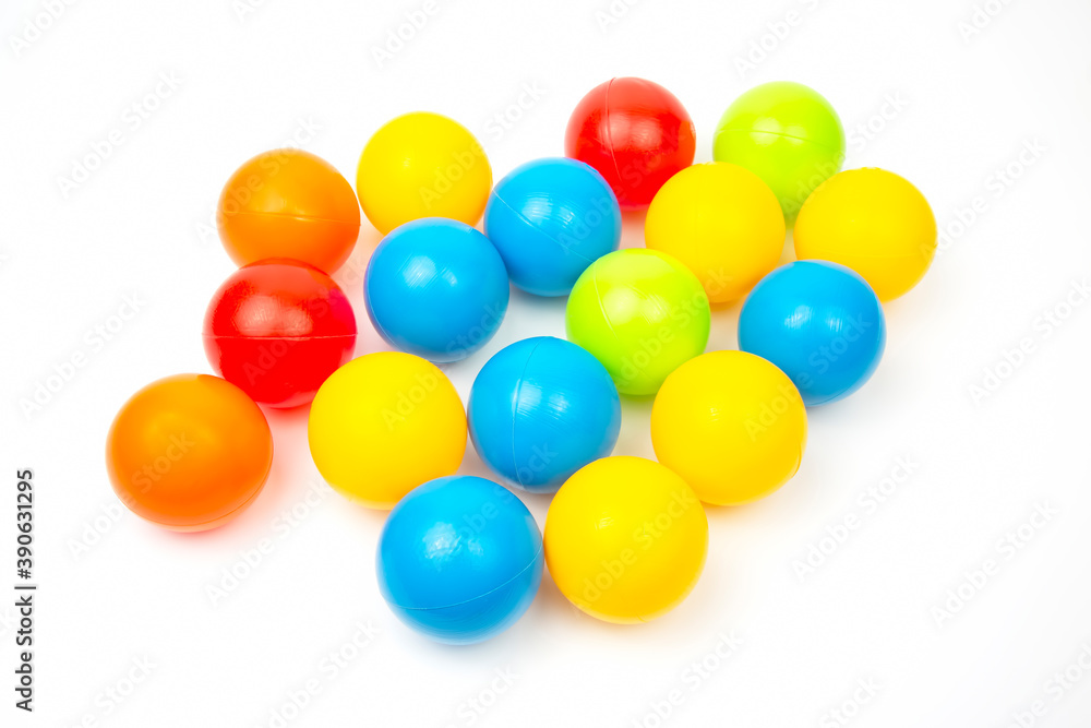 Colored plastic balls on white background. leisure and game items. round objects Colored plastic balls on white background. leisure and game items. round objects