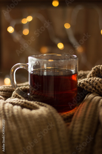 Hot cup of tea in an orange scarf