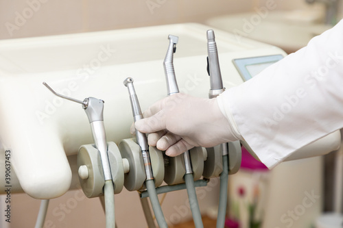Doctor taking stomatological instrument  dental tools close up