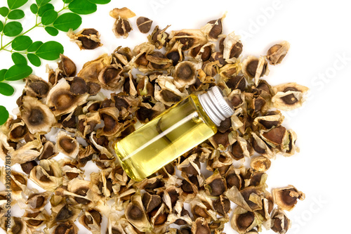 Wallpaper Mural Oil of Moringa in bottle, green leaves and seeds isolated on white background. Moringa oleifera tropical herb product concept.  Torontodigital.ca