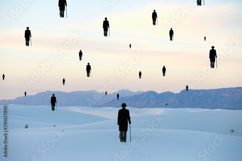 Men in bowler hats with umbrellas, outline of figures floating above ground, in a sand dune desert