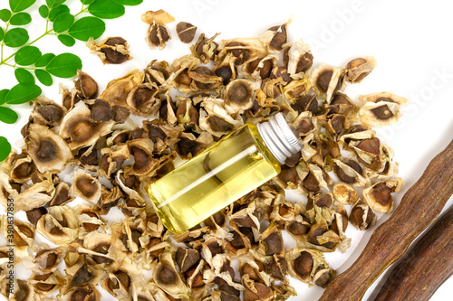 Wallpaper Mural Oil of Moringa in bottle, green leaves, pods and seeds isolated on white background. Moringa oleifera tropical herb product concept.  Torontodigital.ca
