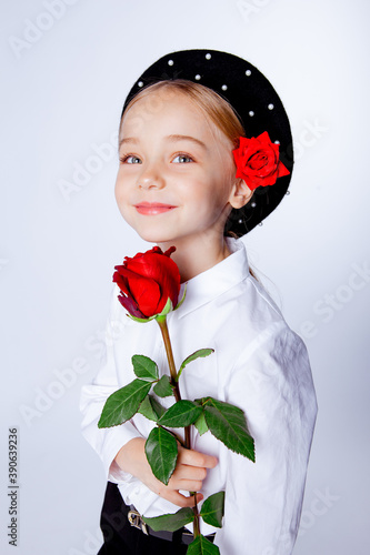 cute five year old girl in a black beret and formal clothes