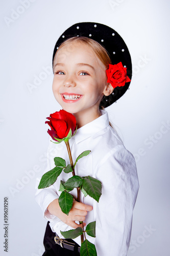 cute five year old girl in a black beret and formal clothes