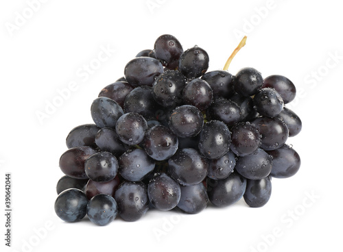 Bunch of fresh ripe juicy dark blue grapes isolated on white