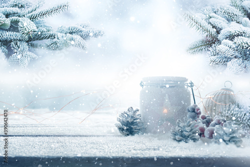 Christmas decoration in a snowy garden
Christmas decoration on wooden table with fir branchs in a snowy garden. Winter background for christmas and advent concepts with space for text. photo