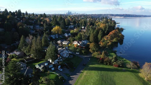 Aerial footage of Lake Washington and the Seward Park residential suburban area looking at the Seattle downtown skyline in King County, Pacific Northwest, Washington photo