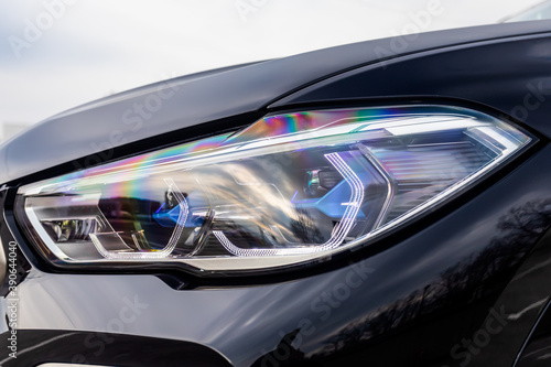 Foto Glowing Headlight of a modern car close-up