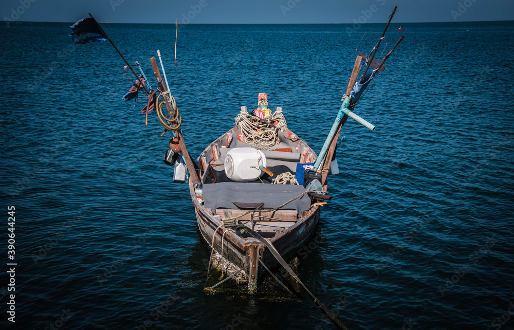 A traditional fishing boat stops at Hat Won Pier, Bang Saen District, Chonburi Province