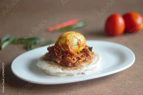 Rice pancake and egg roast, a traditional rice based breakfast dish of Kerala photo