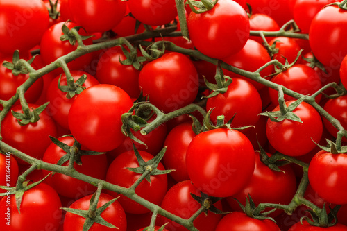 Fresh ripe cherry tomatoes as background  closeup