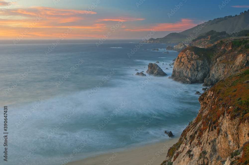 Landscape of the shoreline of the Pacific Ocean near sunset south of Monterey, California, USA