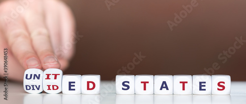 United or divided states of Amerika? Hand turns dice and changes the expression 