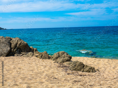 Beautiful beach with golden sand, rocks and the turquoise Mediterranean Sea, Liamone Beach near Ajaccio, Corsica,