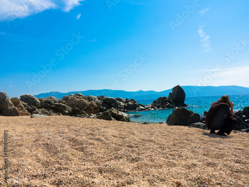 Beautiful beach with golden sand, rocks and the turquoise Mediterranean Sea, Liamone Beach near Ajaccio, Corsica,