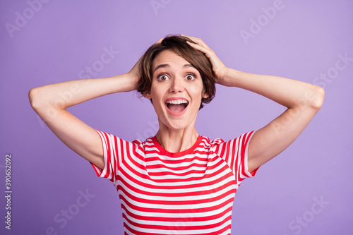 Photo of pretty crazy girl open mouth hands head wear striped t-shirt isolated violet color background