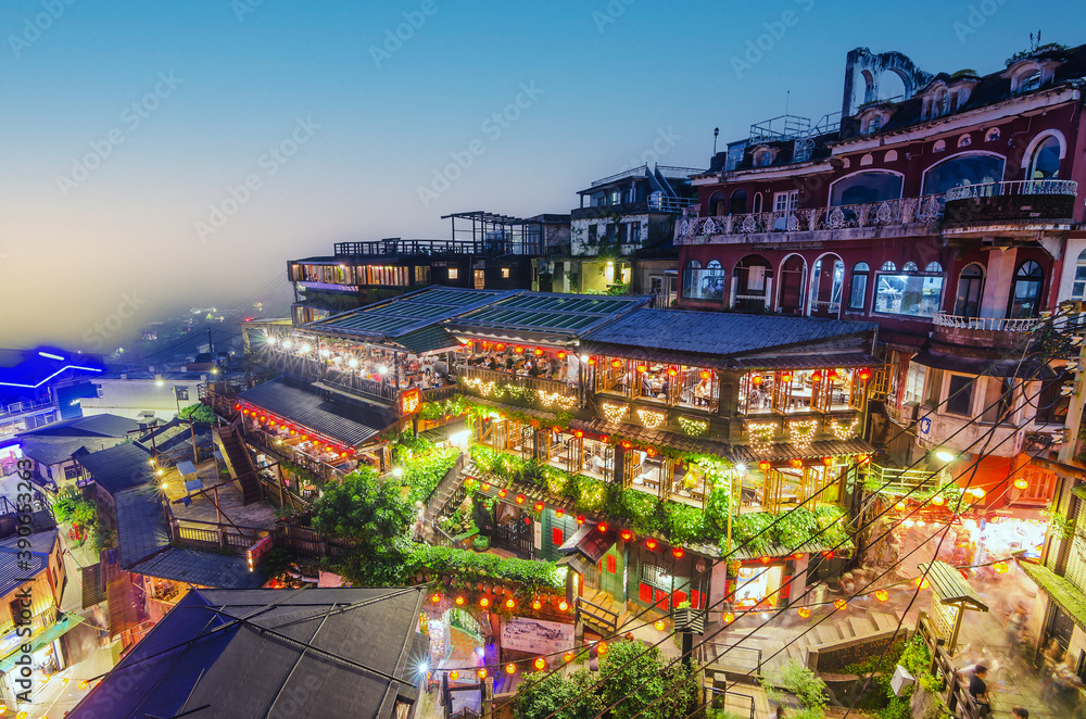 Naklejka premium The top view and night view of Jiufen Old Street, a famous sightseeing area in New Taipei City, Taiwan.