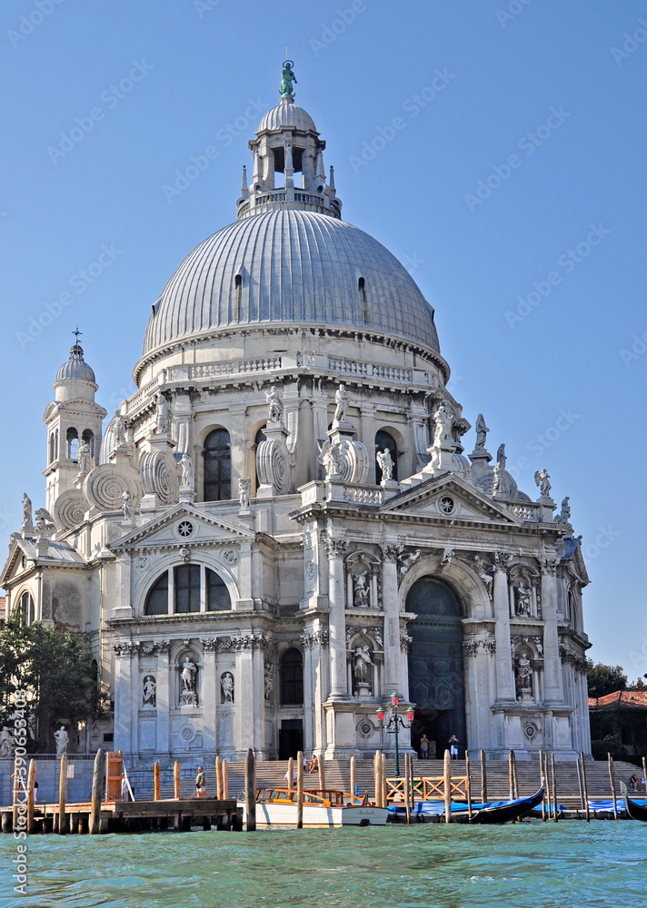 The Basilica di Santa Maria della Salute adorns the Grand Canal of Venice. A noble and landmark structure with beautiful interior and statues of the Apostles.