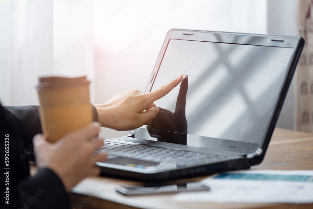 Close up of businesswoman hand pointing at her laptop Close up of businesswoman hand pointing at her laptop