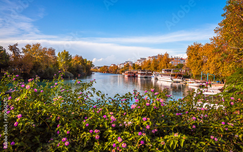 View over Flowers to River Manavgat Autumn Colors and Bright Blue Sky white Clouds