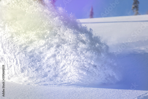 Snowboarder on snowboard rides through snow, explosion. Freeride in winter Ski Resort © Wlad Go