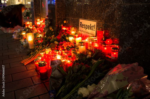 Hanau, Germany - February 20 2020: Flowers and Candles at the Hanau shooting site as a remembrance to the victims. Right extremism. Terror attack.