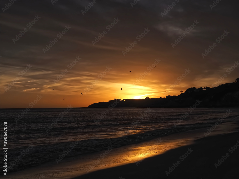 Sunset at a Beautiful Algarve beach with red cliffs, Olhos de Agua, Albufeira