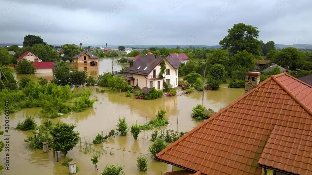 Aerial view of flooded houses with dirty water of Dnister river in Halych town, western Ukraine. Aerial view of flooded houses with dirty water of Dnister river in Halych town, western Ukraine.