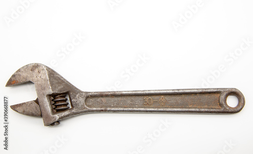 Old rusty Adjustable Wrench on white background. © FO_DE