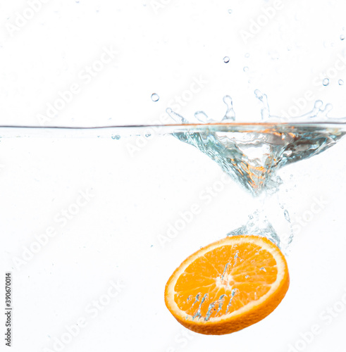 Fototapeta Naklejka Na Ścianę i Meble -  orange in water splash