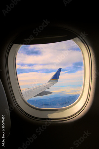Looking out of a airplane window at the wing.