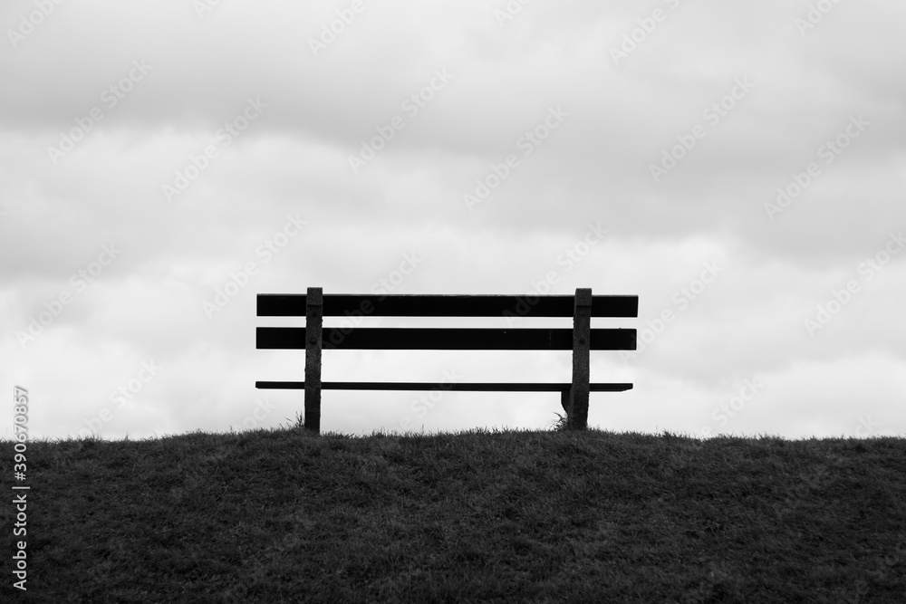 Park bench view on the clouds Doel black and white Park bench view on the clouds Doel black and white