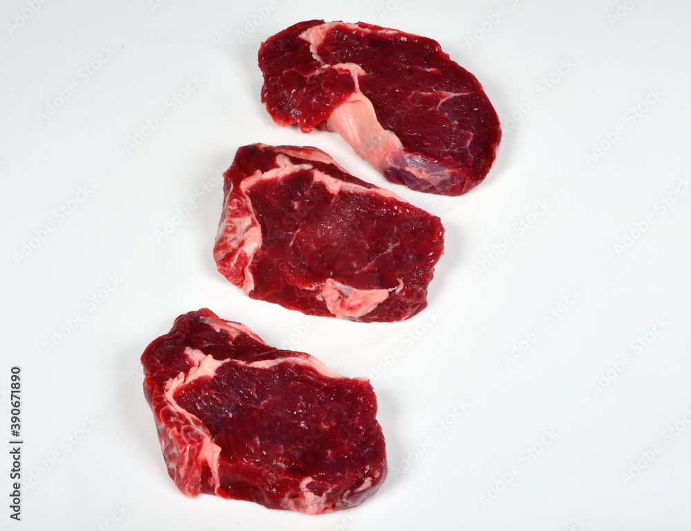Fresh raw beef steak isolated on white background Fresh raw beef steak isolated on white background