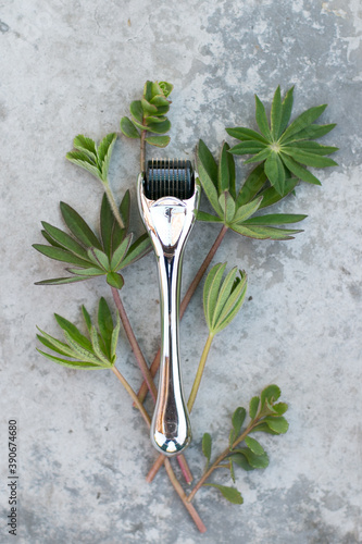 mesoscooter for the face on a concrete background with greenery. the concept of naturalness and environmental friendliness photo