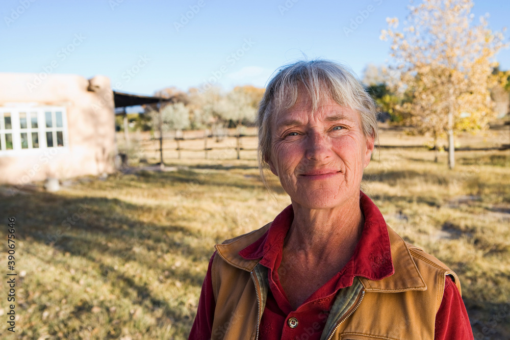 Mature woman at home on her property in a rural setting Mature woman at home on her property in a rural setting