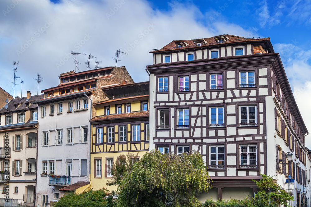 Fototapeta premium Historic houses on the embankment of the Ill river in Petite France district in Strasbourg, France