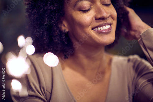 Portrait of a happy young african american woman celebrating Xmas or New Year