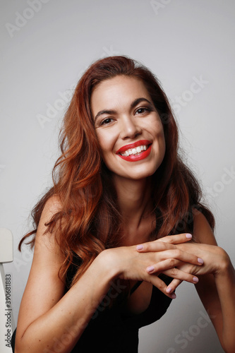 Portrait of a young woman with a beautiful smile. Isolated on white background.
