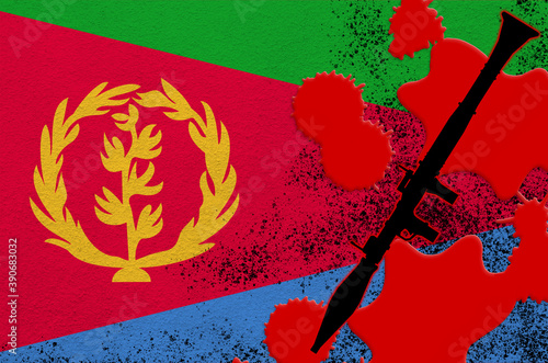 Eritrea flag and black RPG-7 rocket-propelled grenade launcher in red blood. Concept for terror attack or military operations with lethal outcome photo