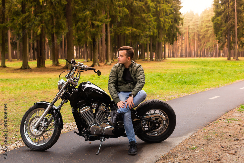 Beautiful young man, road, motorcycle
