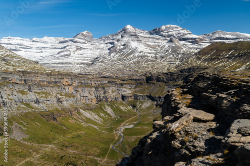 Views from Cuello Gordo of Ordesa National Park with the Horsetail waterfall and peaks of Monte Perdido, Añisclo, Punta Olas, Cilindro del Marbore snow-capped on a summer day in the Aragonese Pyrenees photo