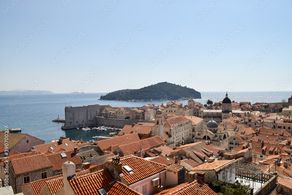 Beautiful Dubrovnik old city seen from the top of the historic wall. In the background, Lokrum island.
