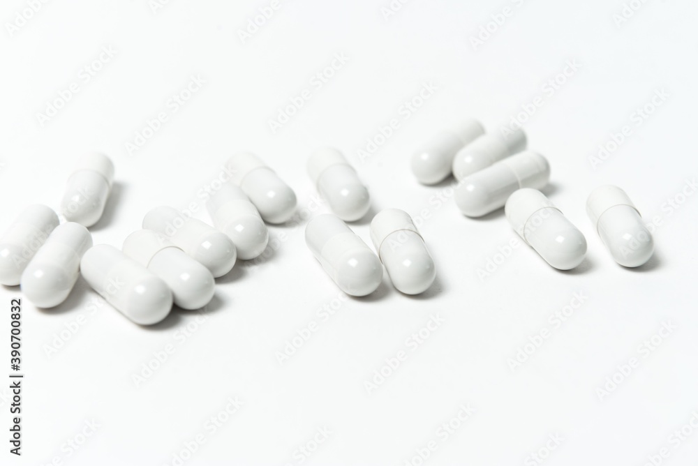 white capsule pills isolated on white white capsule pills isolated on white