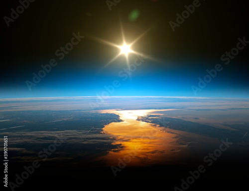 Earth and sun. Elements of this image furnished by NASA.